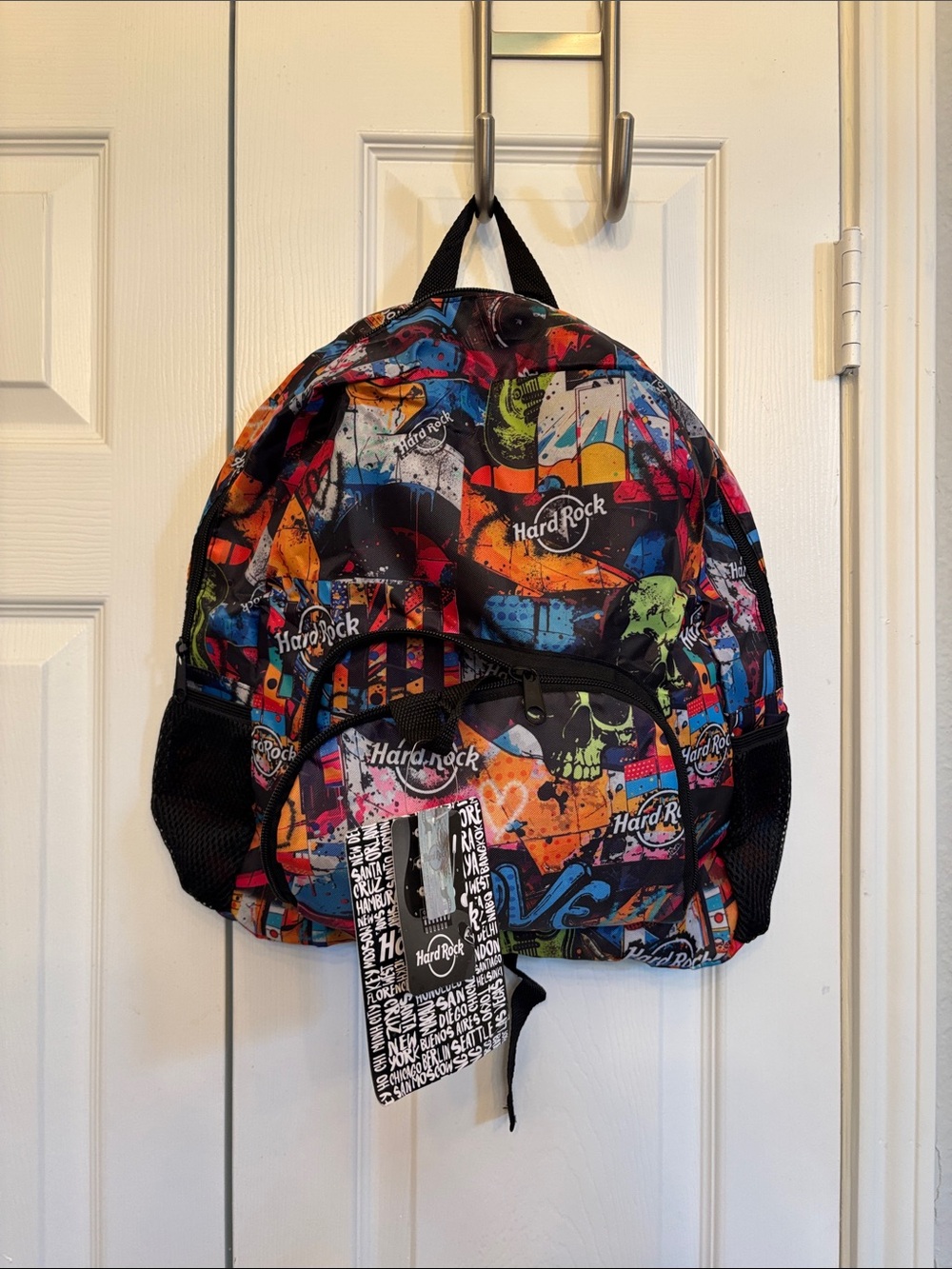 Hard Rock Cafe Multicolor Graffiti Skull Backpack with Neon Green Tag